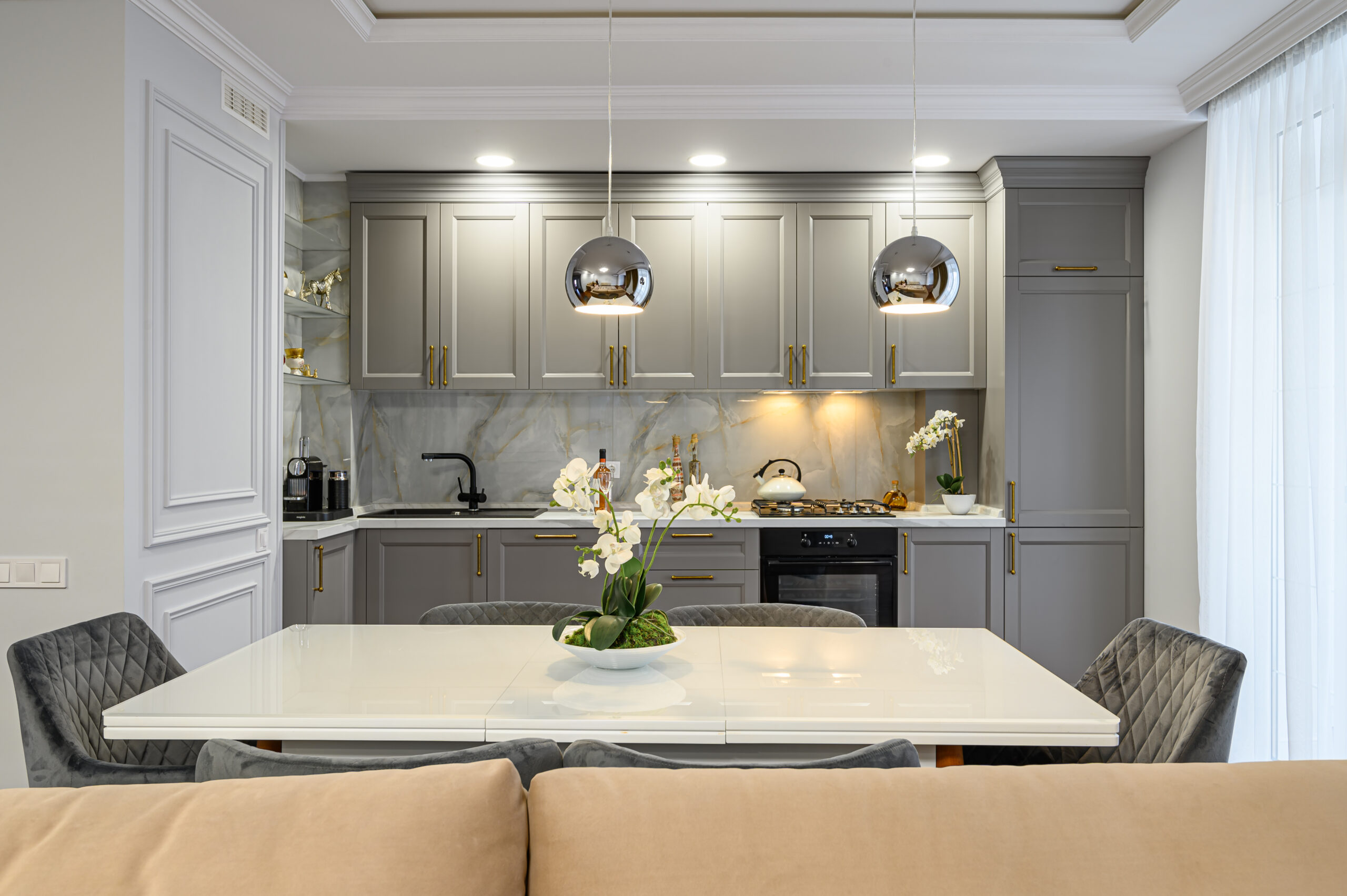 Grey and white contemporary classic kitchen interior designed in modern style being a part of studio apartment